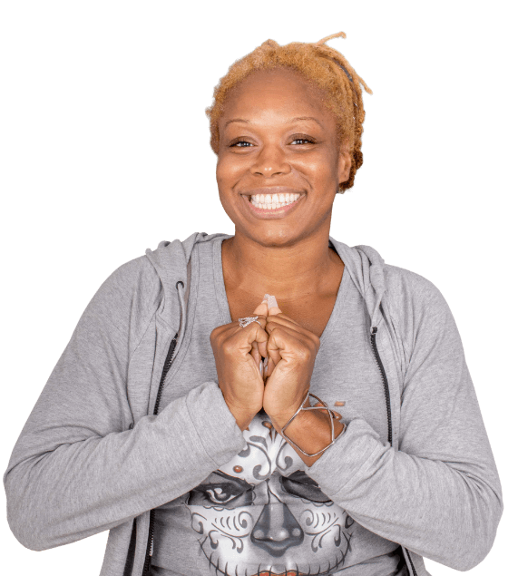 black young woman smiling after getting her dental veneers in Los Cabos, Mexico