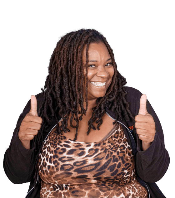 black young woman smiling after her full mouth restoration with dental crowns in abo San Lucas, Mexico