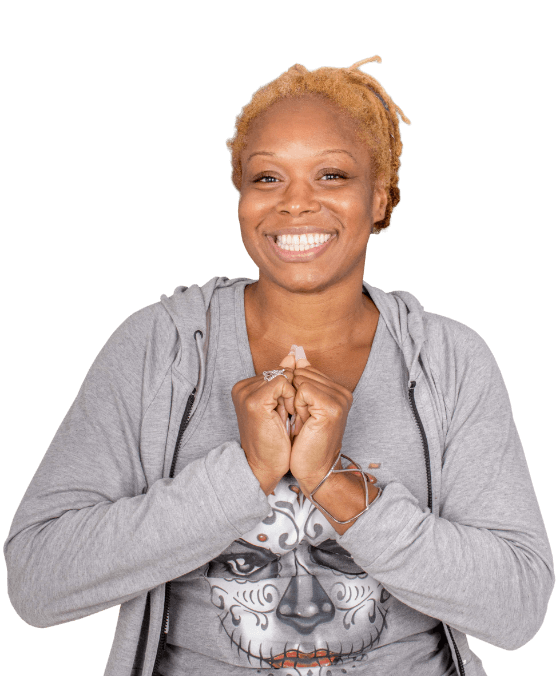young black woman smiling with her dental bridges in Advanced Cabo Dentistry