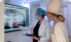 dentist in cabo san lucas explaining to a patient her treatment plan to get dental crowns