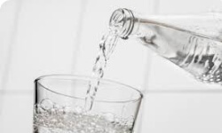 Glass of water for a white diet after teeth whitening