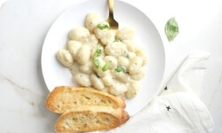 White diet plate with bread and chicken