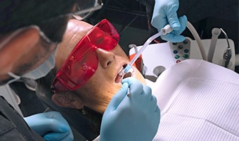 Dentist performing an evaluation for dental implants