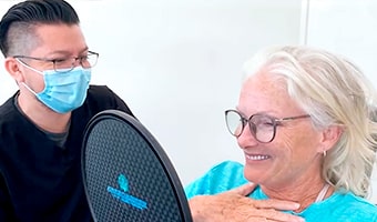 Happy Cabo Patient seeing her new Smile
